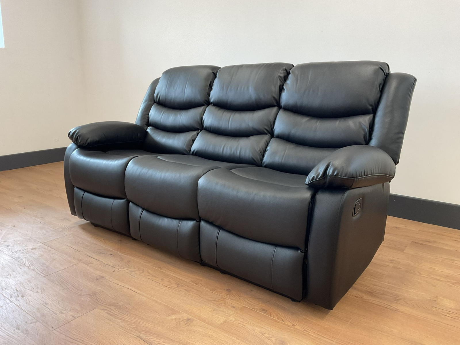 Conrad Black Faux Leather Manual Reclining Sofas