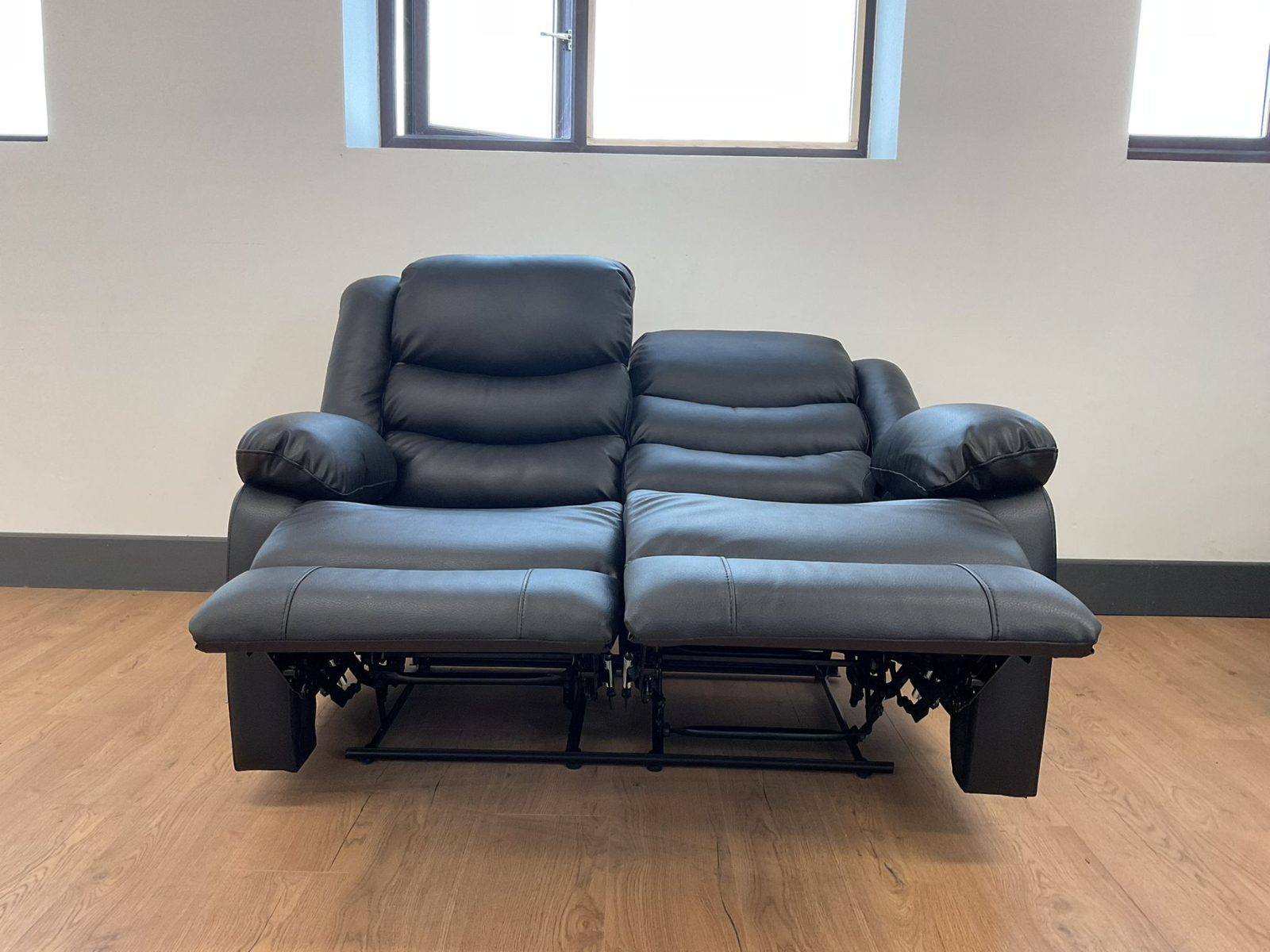 Conrad Black Faux Leather Manual Reclining Sofas