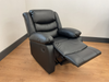 Conrad Black Faux Leather Manual Reclining Sofas