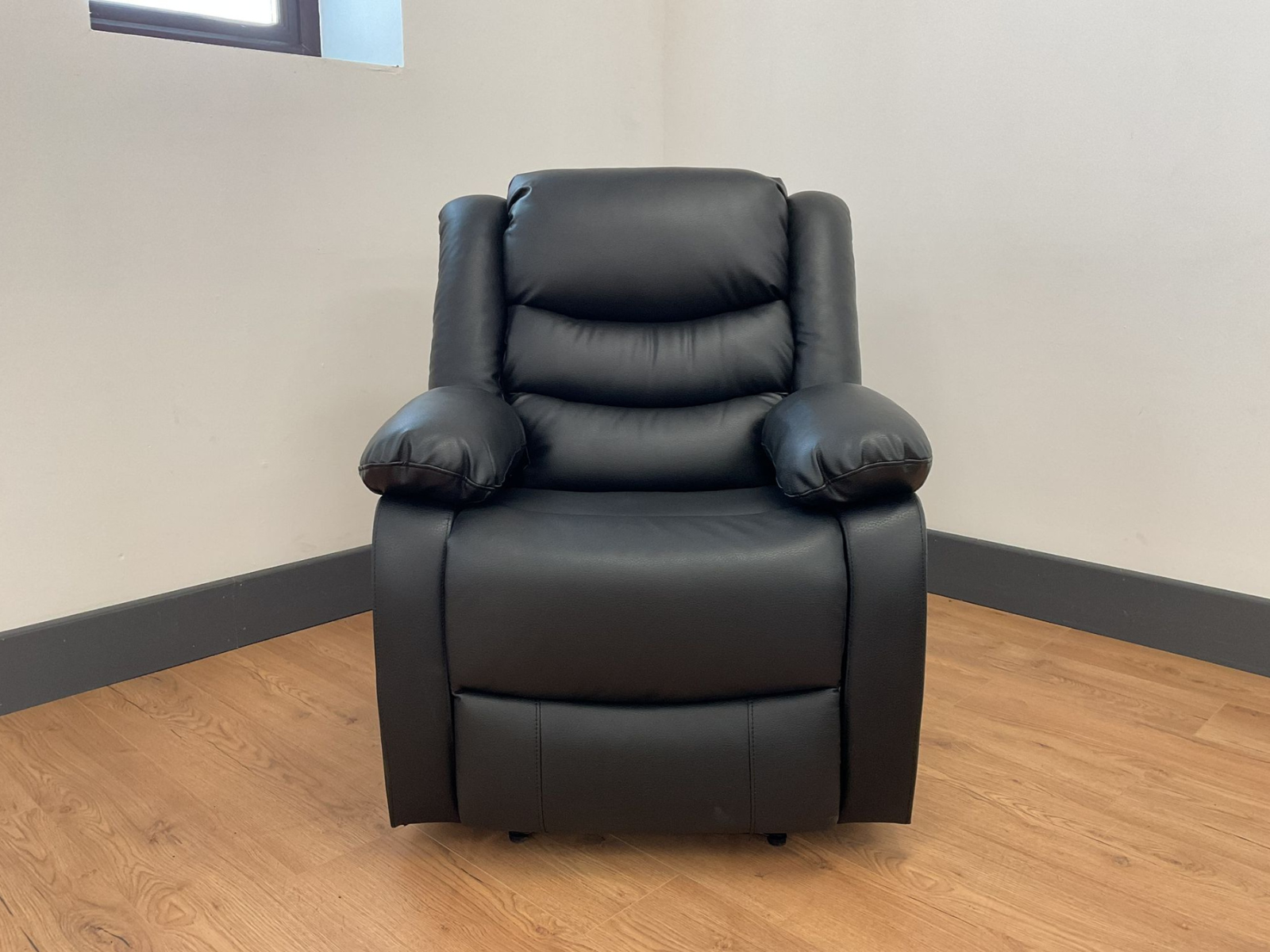 Conrad Black Faux Leather Manual Reclining Sofas