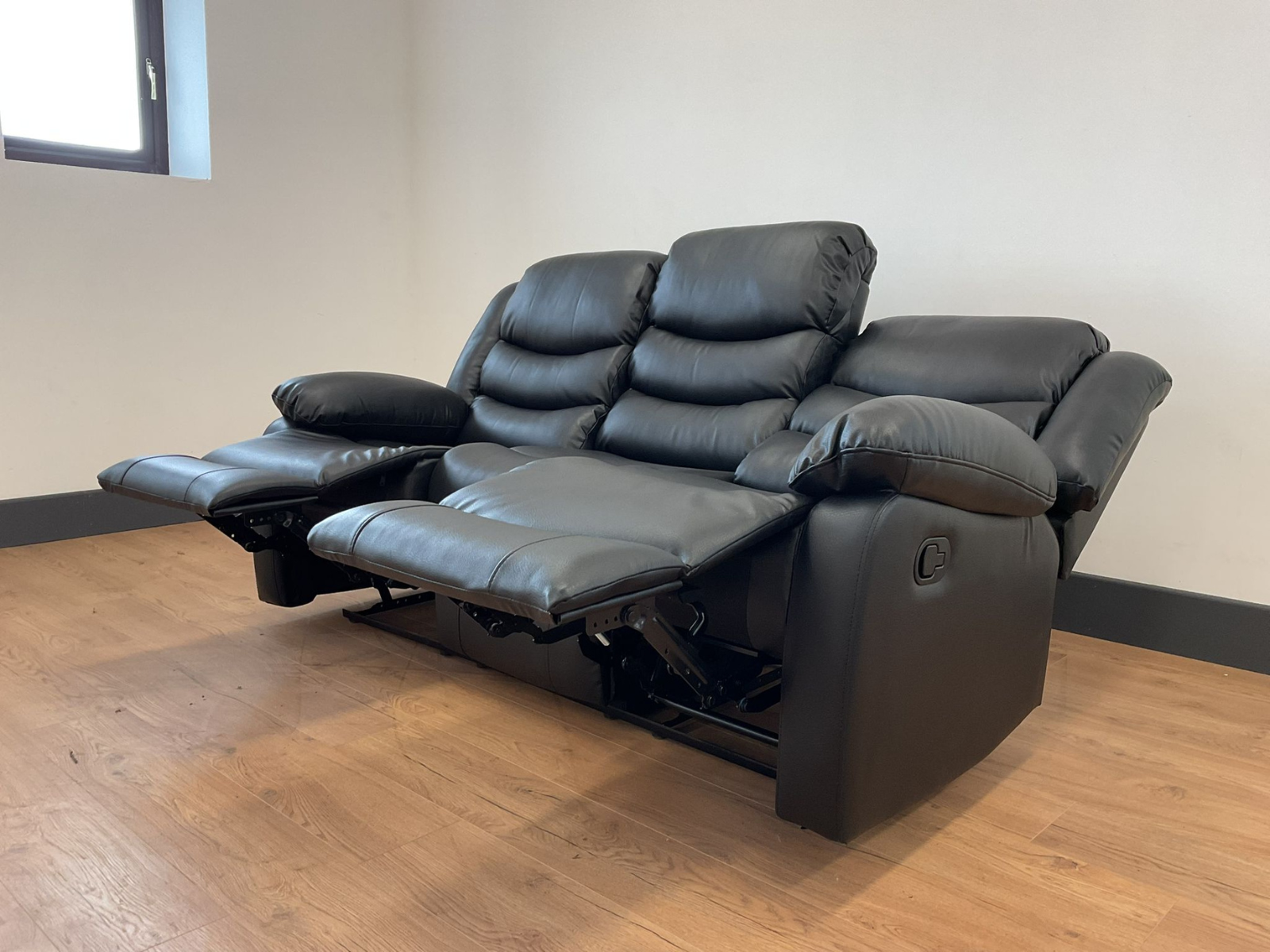 Conrad Black Faux Leather Manual Reclining Sofas