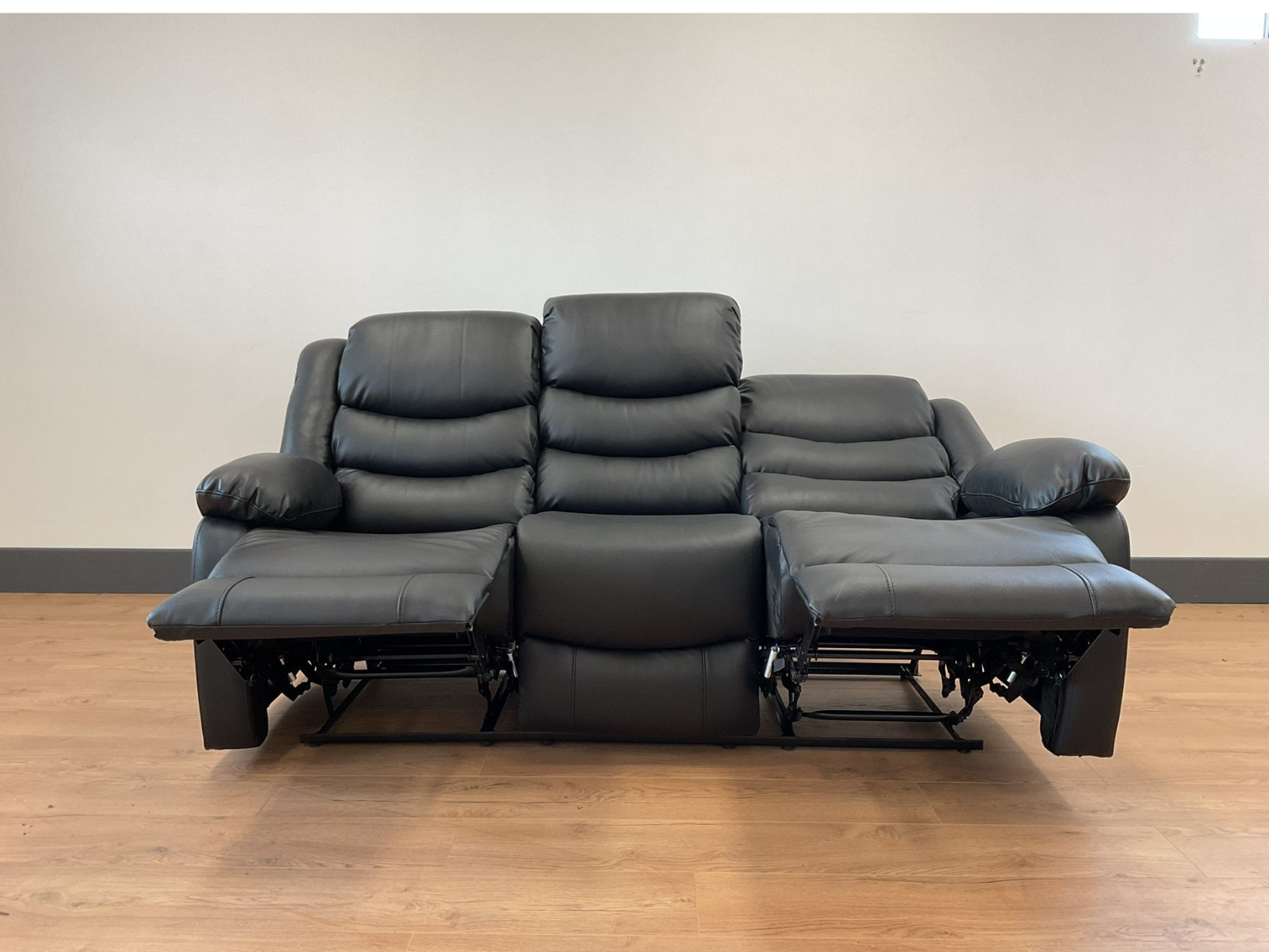 Conrad Black Faux Leather Manual Reclining Sofas